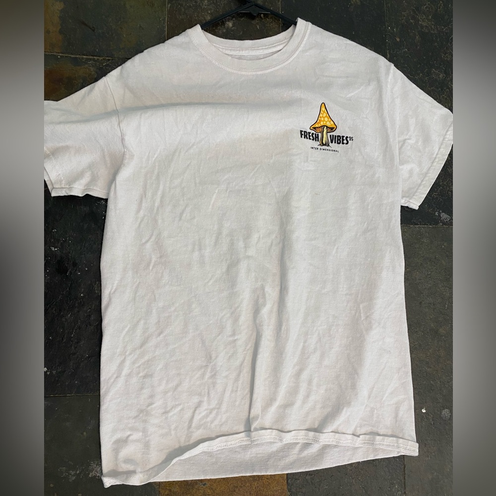 white tee with design on back